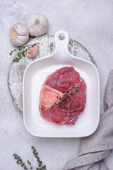 Raw uncooked ossobucco steak with spices