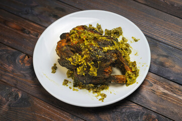 Ayam Golek or  Grilled Chicken with green chilli  Sauce Melayu Style on wooden 