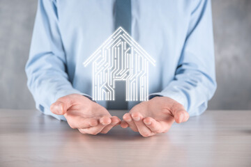 Businessman hold house icon.Smart home controlled, intelligent house, and home automation app...