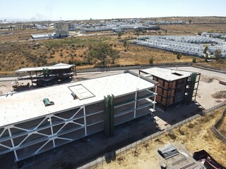 vista aerea de edifico, Stacked of Package Boxes Load into Cargo Container. Truck Parked Loading at Dock Warehouse. Delivery Service. 