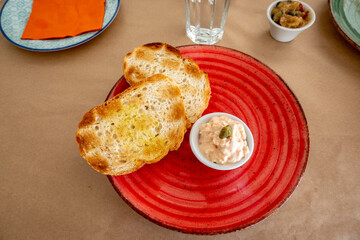 Toast with cheese sauce, a typical starter in a Greek restaurant. Paros island, Greece