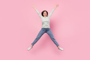 Fototapeta na wymiar Full body photo of positive funky young woman jump up star shape good mood isolated on pink color background