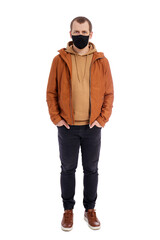 Fototapeta premium full length portrait of handsome man in autumn jacket wearing mask isolated on white background