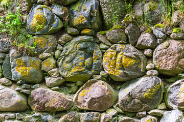 Fototapeta na wymiar Ancient Stone Wall at an Abandoned Building