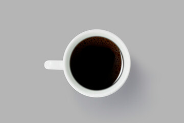 Black coffee in a white coffee cup isolated on gray background - Top view with copy space