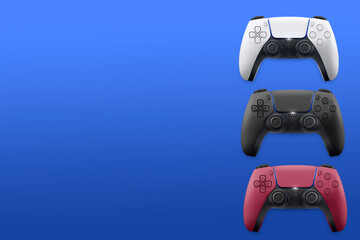 White, black and red next generation game controllers on blue background. Top view. © Diego