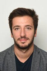 Obraz premium smiling bearded young man with suit jacket