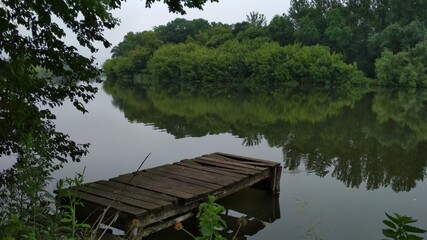 Fototapeta na wymiar wooden bridge on the lake