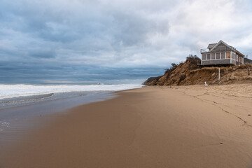 Coastal Erosion Imperils Beachhouse at Ballston Beach in Truro, MA