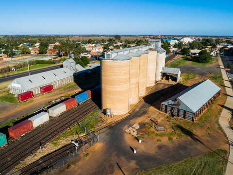 Aussie country town scene in Narromine of grain silos beside railway and freight train