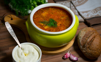 Traditional soup - borsch on the table.  Image with selective focus