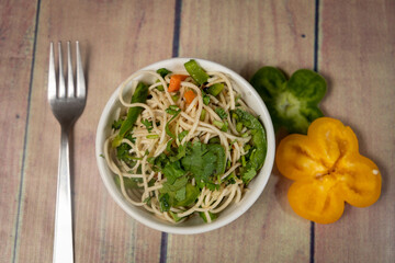 colorful noodles with vegetables and capsicum