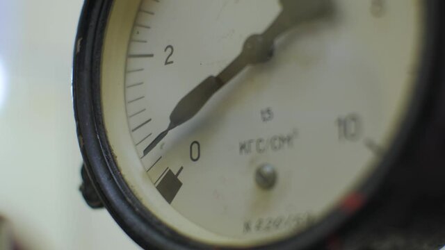 The needle of the manometr rises up close up