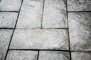 Obraz premium Abstract background. Old cobblestone pavement close-up. City