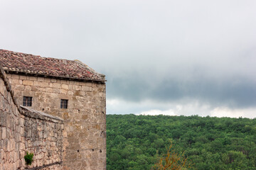 Fototapeta premium The house on the mountain. The house is at a high altitude.Stormy sky.