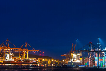 Cranes at the edge of the container terminal in the port of Gdynia, Poland.