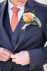 Groom finishes up wedding preparation