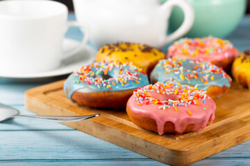 Delicious assorted colorful donuts on the table.