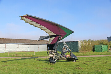 Ultralight airplane on a grass airfield