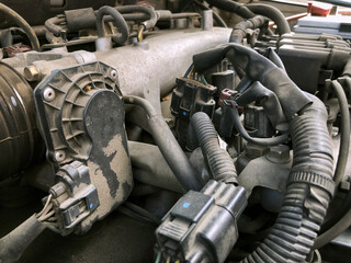 Fototapeta na wymiar Car gasoline engine photo. Car engine parts. Close-up image, internal combustion engine, used car, natural light, color.