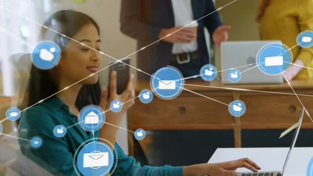 Animation of network of connections with icons over businesswoman using smartphone