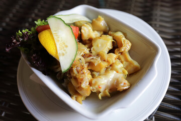 Fried rapana meat with onions