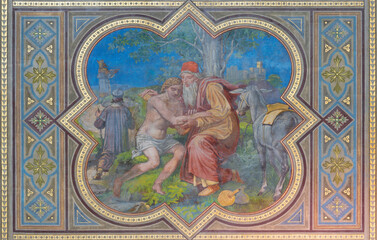 VIENNA, AUSTIRA - JUNI 24, 2021: The fresco good Samaritain in the Votivkirche church by brothers...