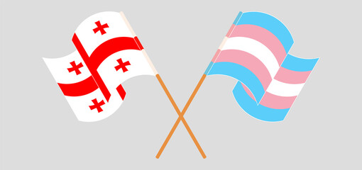 Obraz premium Crossed and waving flags of Georgia and Transgender Pride