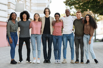 Multiracial group of happy millennial men and women outdoors