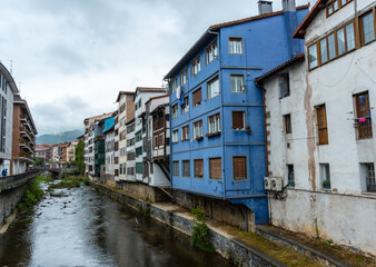 Fototapeta na wymiar Traditional blue house in the town of Azkoitia next to the Urola river, Gipuzkoa. Basque Country