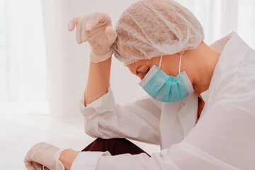 Fototapeta premium doctor is tired and stressed due to covid-19 virus pandemic