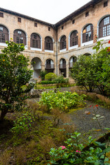 Fototapeta na wymiar Inner courtyard of the old Santa Clara Monastery in the town of Azkoitia next to the Urola river. Founded by Don Pedro de Zuazola, Gipuzkoa. Basque Country