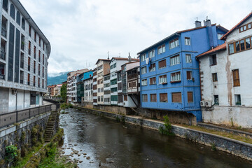 Fototapeta na wymiar Traditional blue house in the town of Azkoitia next to the Urola river, Gipuzkoa. Basque Country