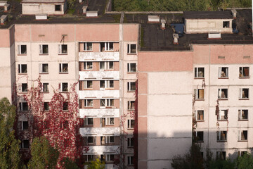 Overgrown houses in post pocalyptic town Pripyat