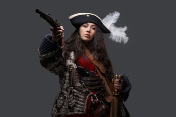 Attractive woman corsair with saber and flintlock