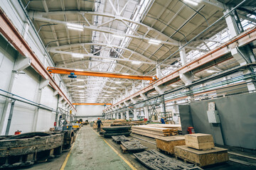Large industrial warehouse or workshop in modern factory. Woodworking workshop interior.