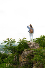 Woman with backpack hiking in nature