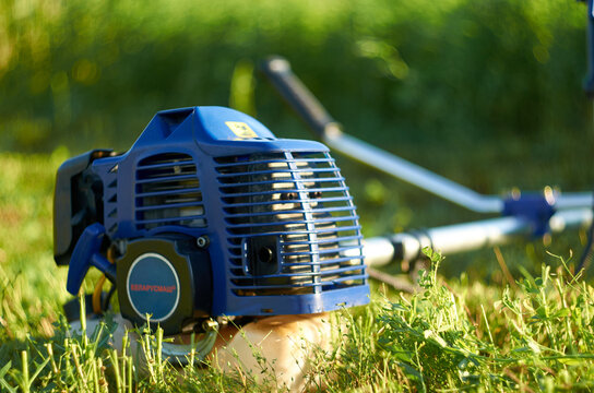 Weed trimmer on the grass