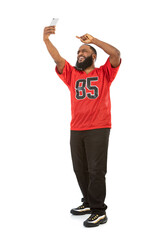 Naklejka premium Fan: Sports Man Takes Selfie With Cell Phone