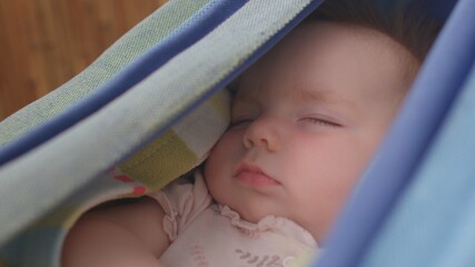 Baby sleep in the hammock. Toddler dreams are just snapshots, looking like a slideshow. The REM...