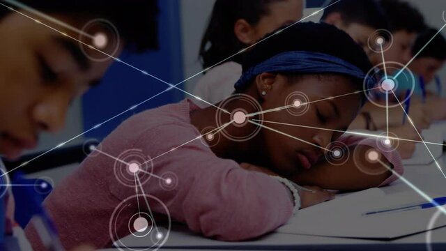 Animation of network of connections moving over tired schoolgirl lying on desk in classroom