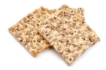 Stack of wholegrain crispy bread with sunflower, linen and sesames seeds, isolated on white background. High resolution image.