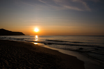 beautiful sunset on the sea. beach and surf at sunset.