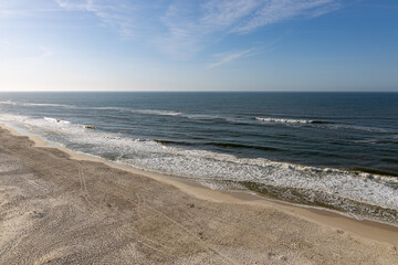 A drone shot of an empty beach on a clear beautiful day