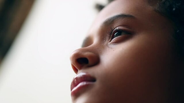 Pensive little girl close-up face, contemplative child