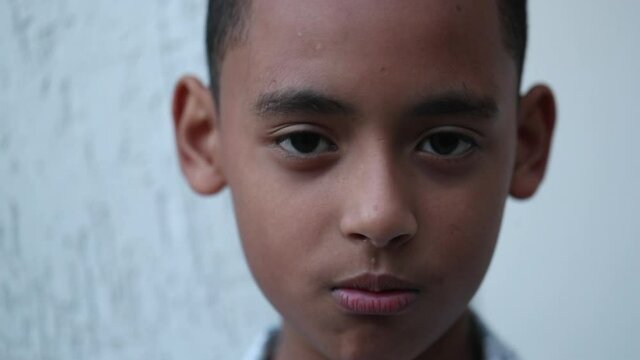 Serious young boy black kid portrait