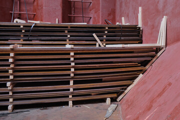 View of wooden separation and dunnage of hot rolled steel plates inside cargo hold of bulk carrier