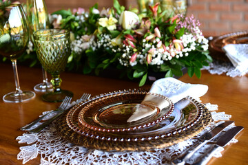 restaurant table set with dishes and cutlery with blurring points
