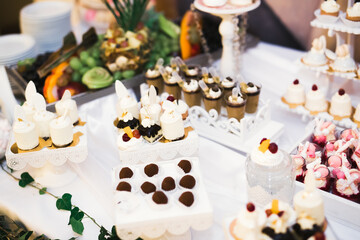 Delicious wedding reception candy bar dessert table