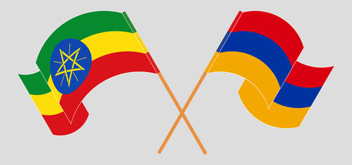 Crossed and waving flags of Ethiopia and Armenia